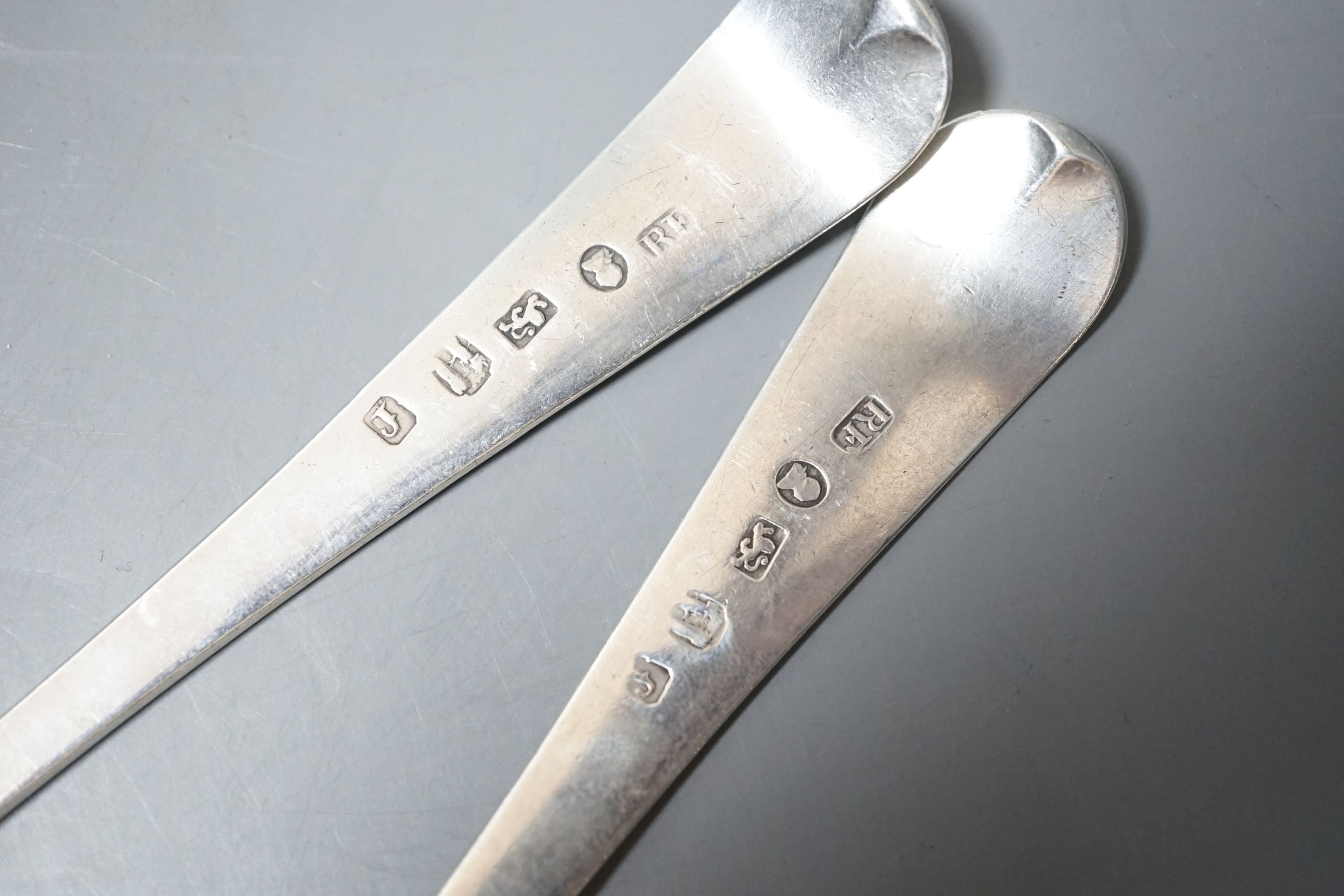 A near pair of George III provincial silver Old English pattern table spoons, by Richard Ferris, Exeter, 1791, with differing bright engraving and one with engraved date and initials, 21.4cm, 110 grams